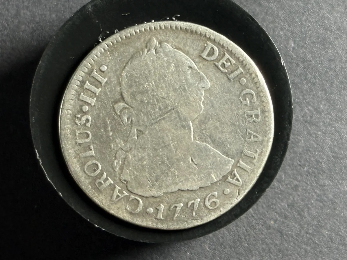Obverse of a 1776 Spanish colonial 2 reales silver coin showing Carolus III